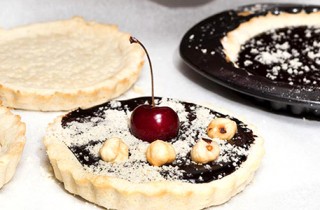 Receta de tartelettes de chocolate, frutos rojos y avellanas